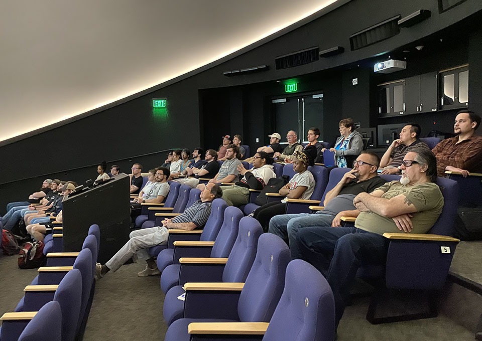 attendees listen to presenter