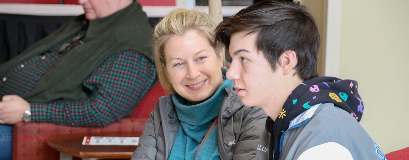 A mother looks on at her son during a Frostburg State Bobcat Welcome session