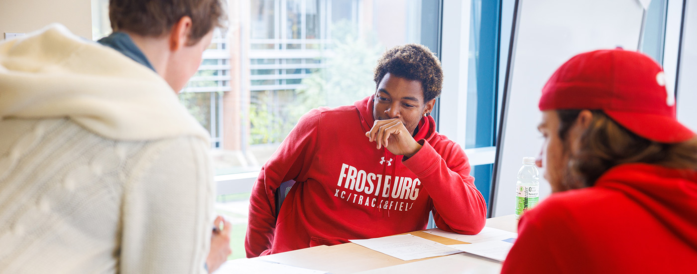 teacher explaining assignment in class